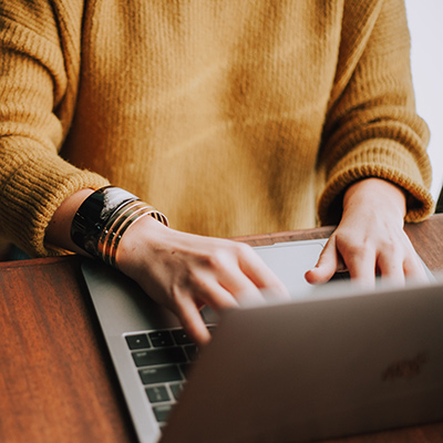 laptop with hands