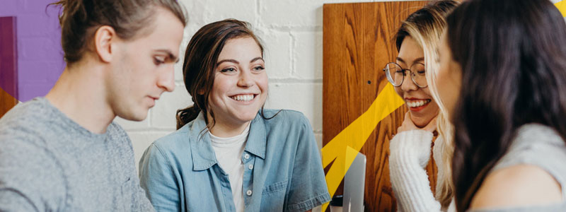 students at table chatting