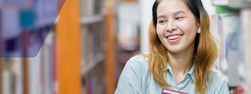 student in library