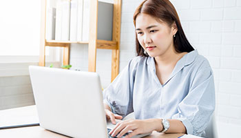 Teacher looking at laptop